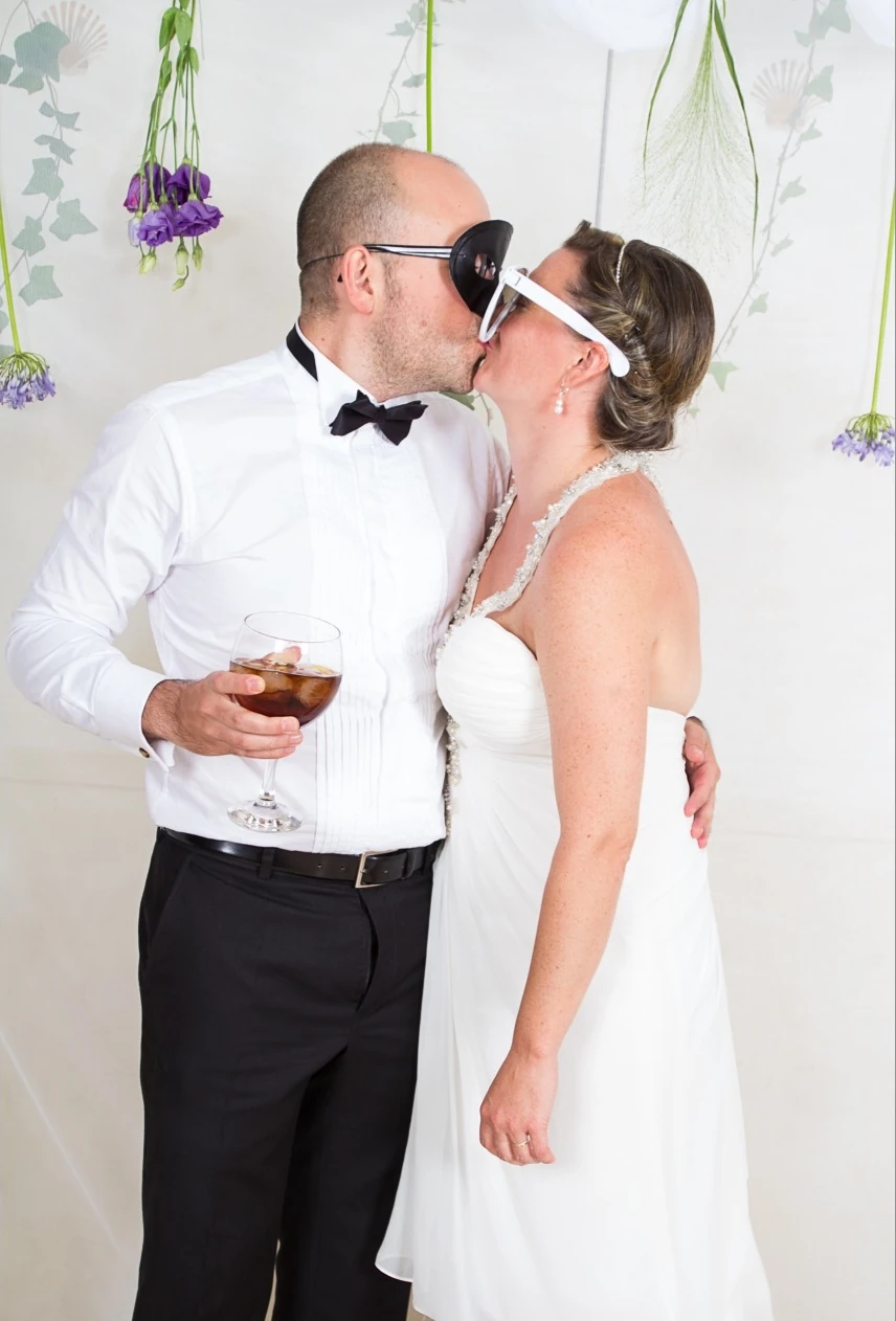 A kiss at the wedding photo booth